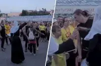 Монашка избивает уличного музыканта на "Славянском базаре" / коллаж Еврорадио

